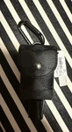 Coach Charcoal Canvas Sanitizer Holder. Fixed Price $49.99.